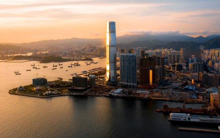 Cityscape and harbour at sunset.
