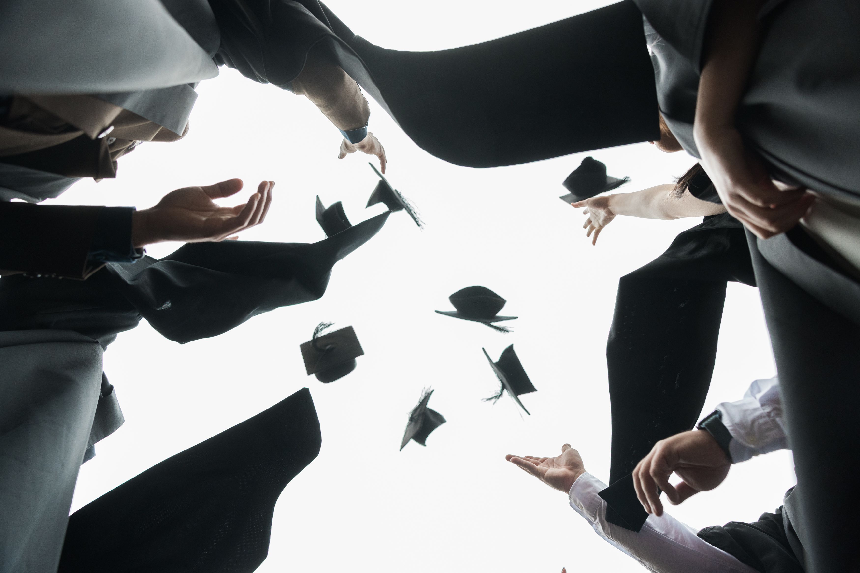 Students sitting exams in a school hall. 