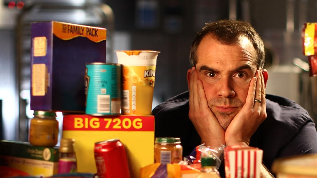 Dr Chris van Tulleken, surrounded by ultra-processed foods
